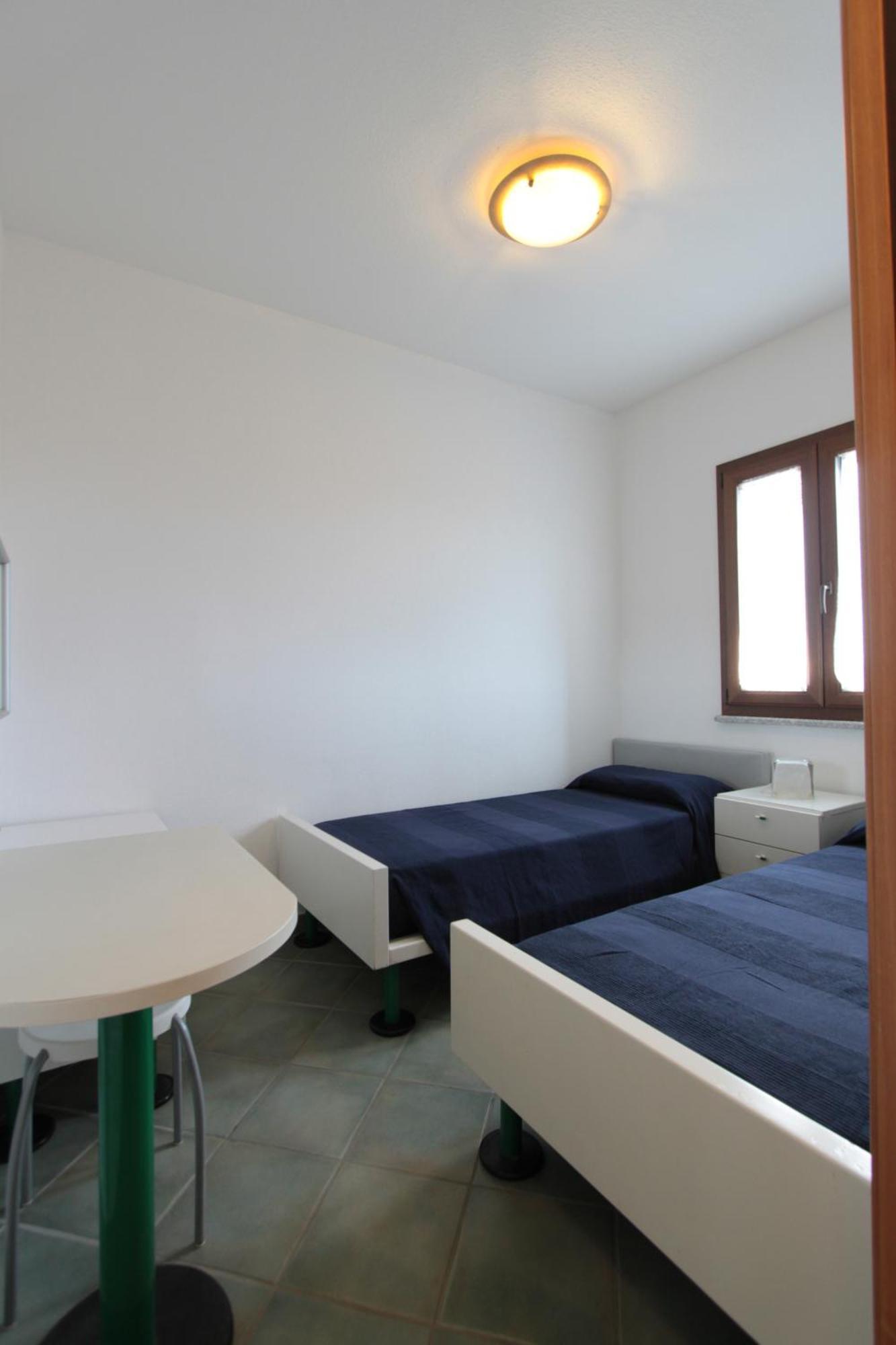 Hotel Residence Hibiscus La Caletta Kamer foto